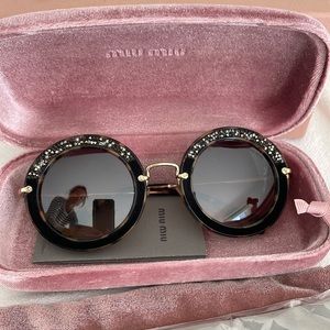 MiuMiu round derailed sunglasses